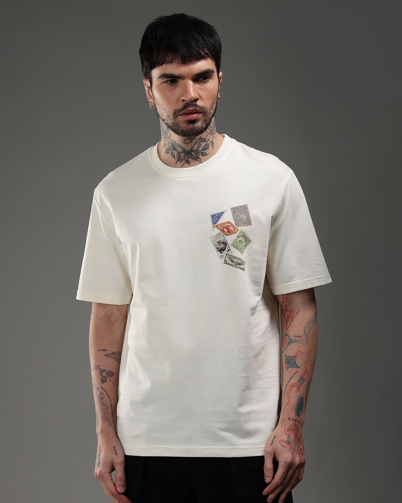 Snowpard Global Stamps Relaxed Tee Off White — back view, oversized framed stamp wolf artwork