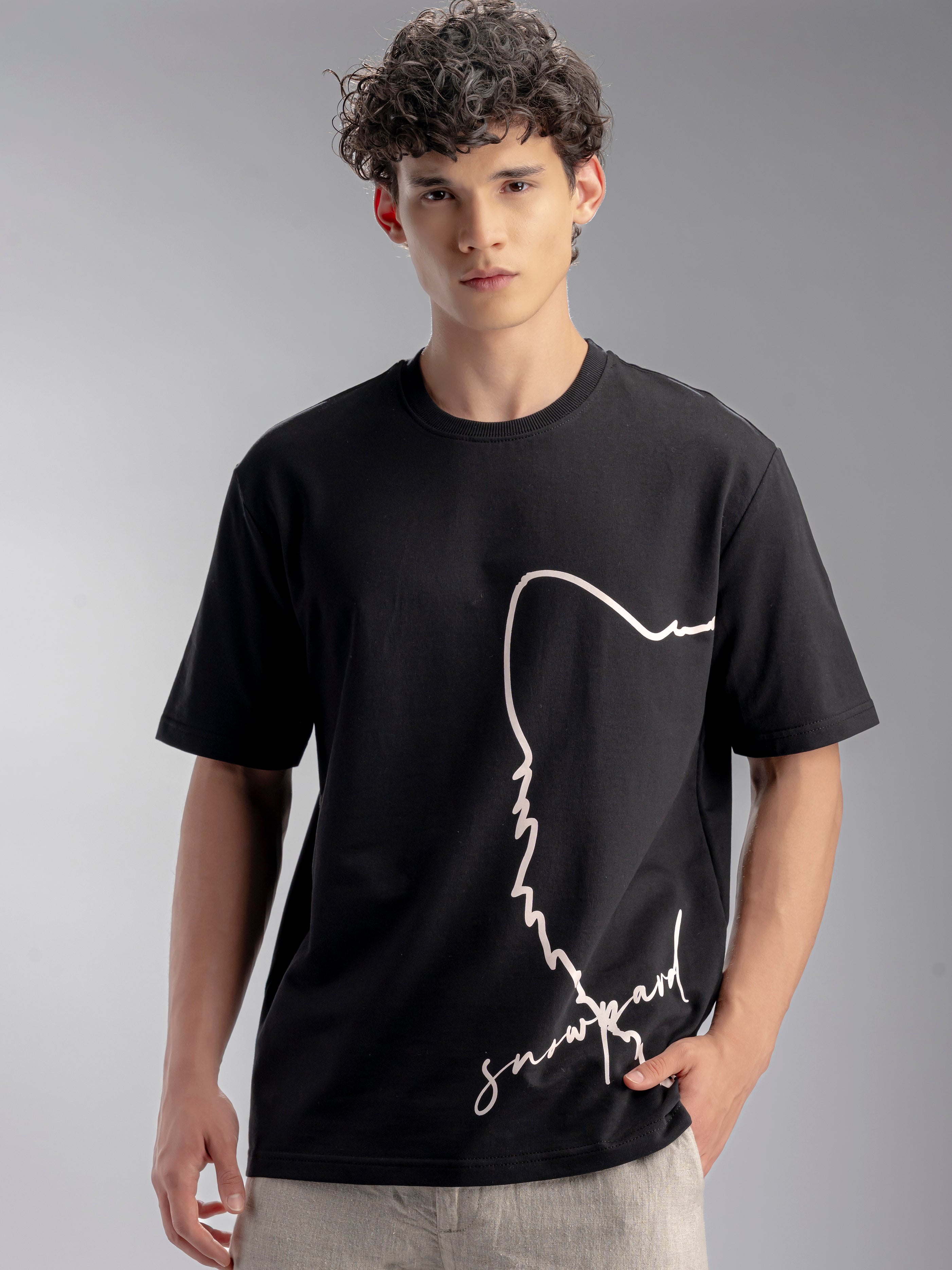 Person wearing a black t-shirt with a white graphic design