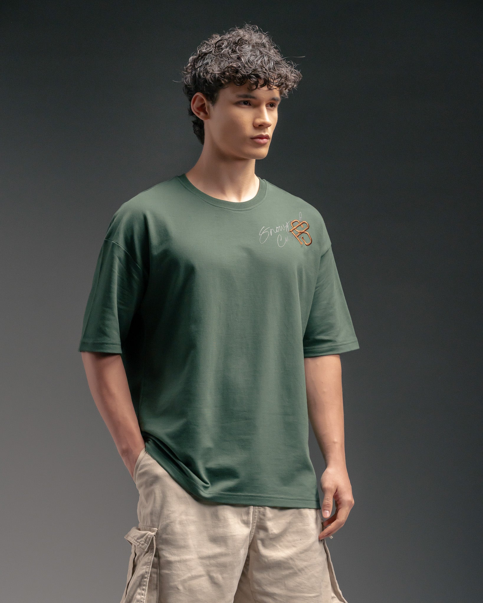 Snowpard Custos Relaxed Tee Forest Green — back view, refined Custos chest graphic embroidery