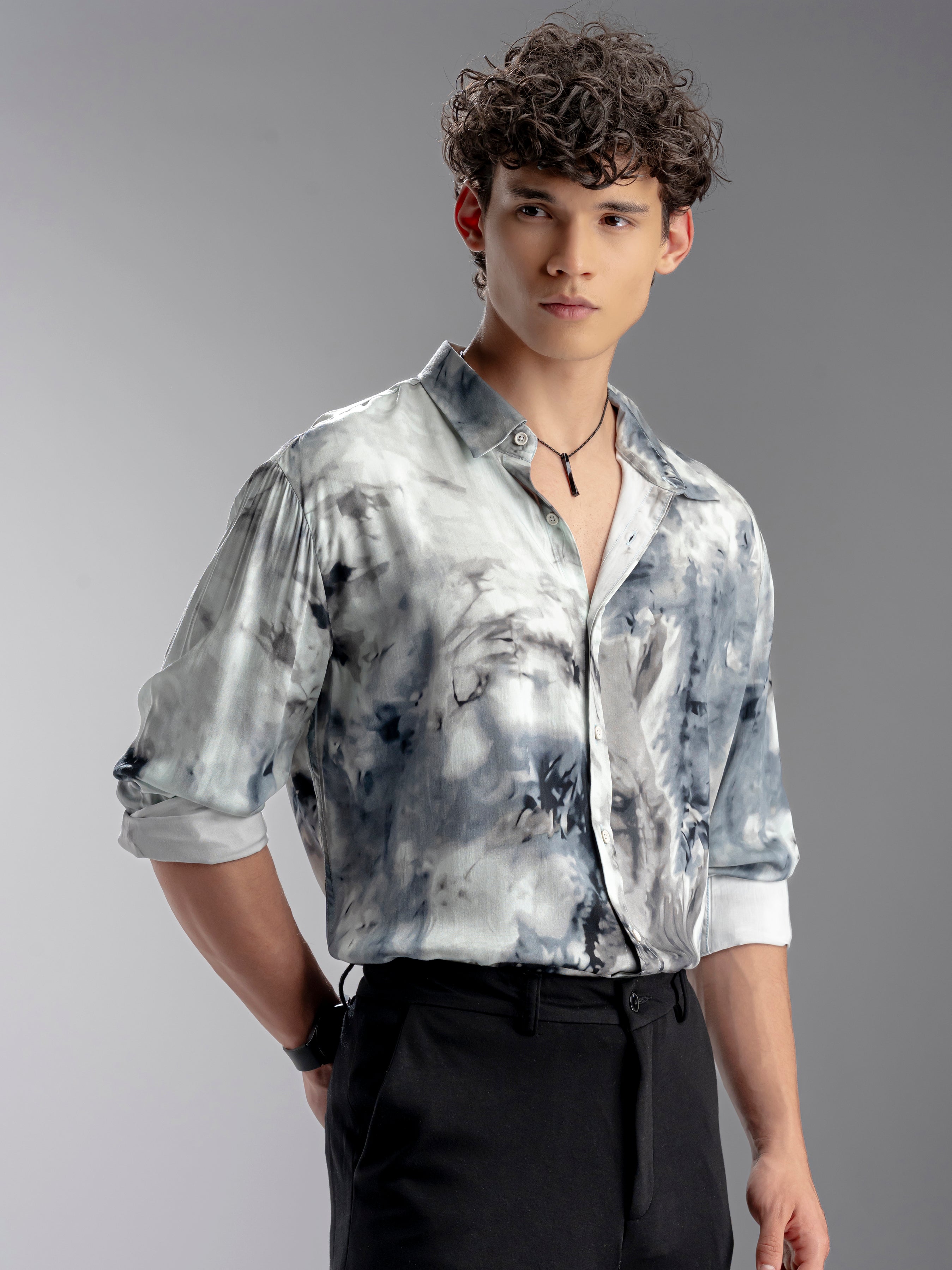 Man wearing a tie-dye shirt and black pants