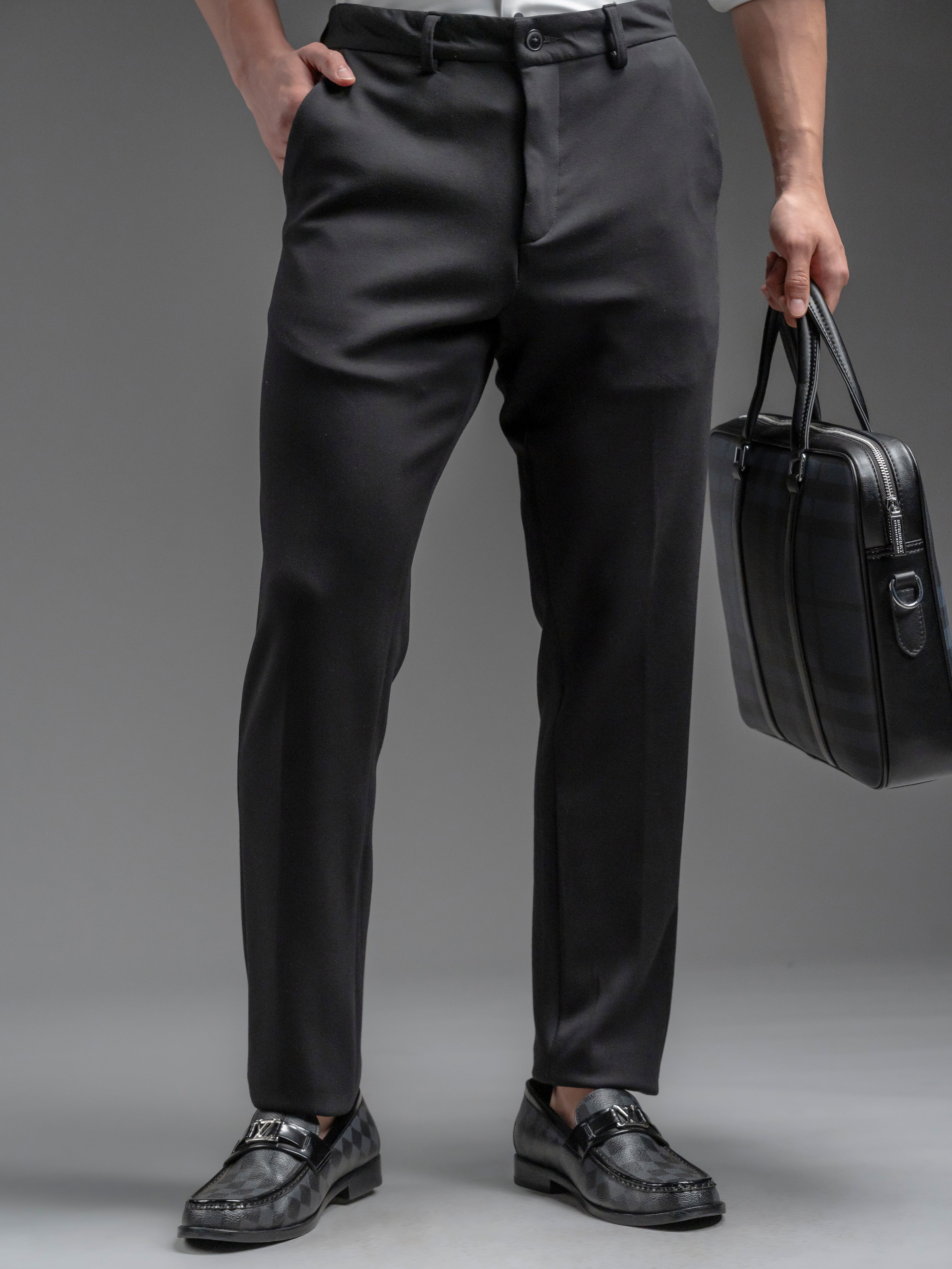 Person wearing dark gray dress pants