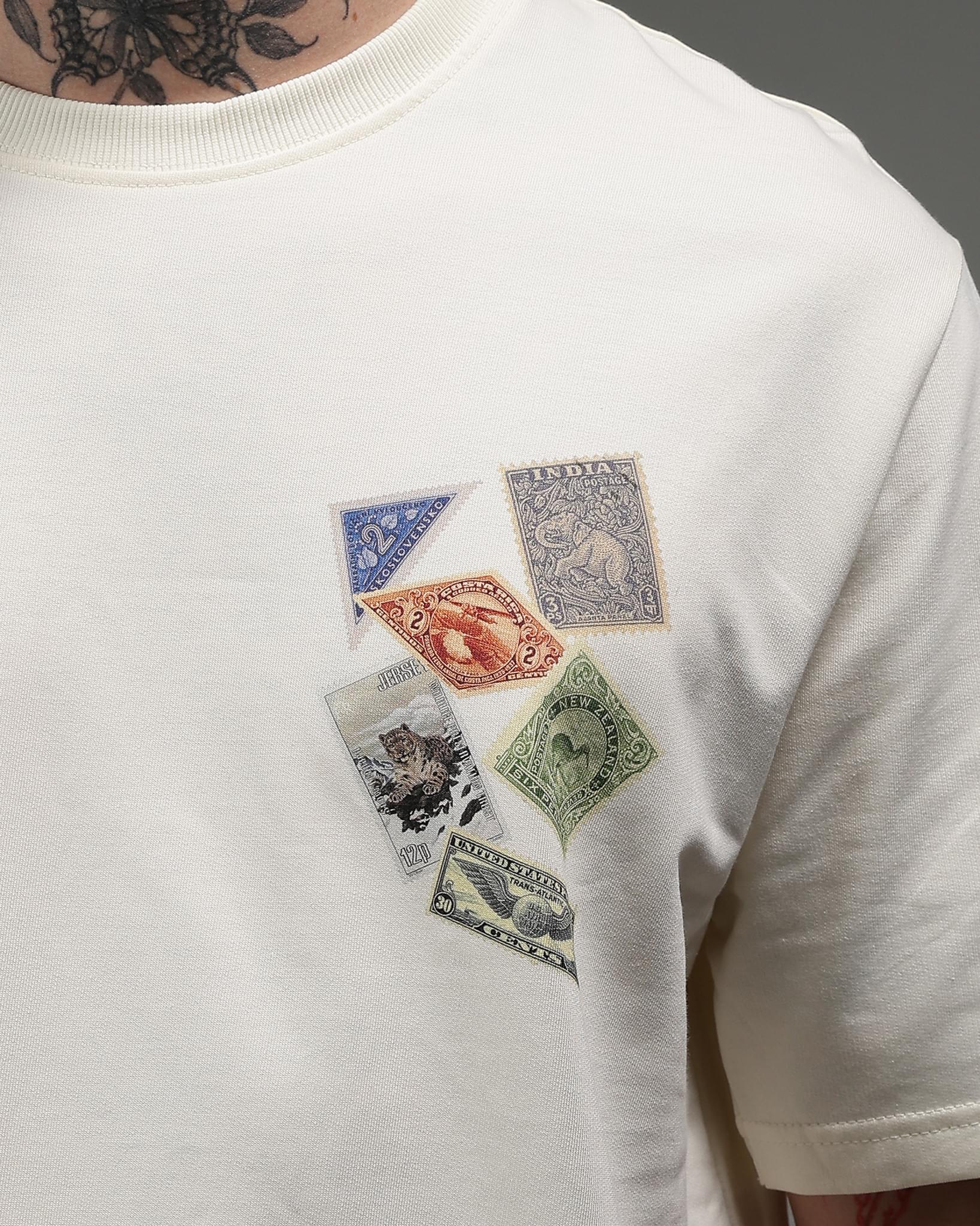 Snowpard Global Stamps Relaxed Tee Off White — model shot, premium men's graphic t-shirt