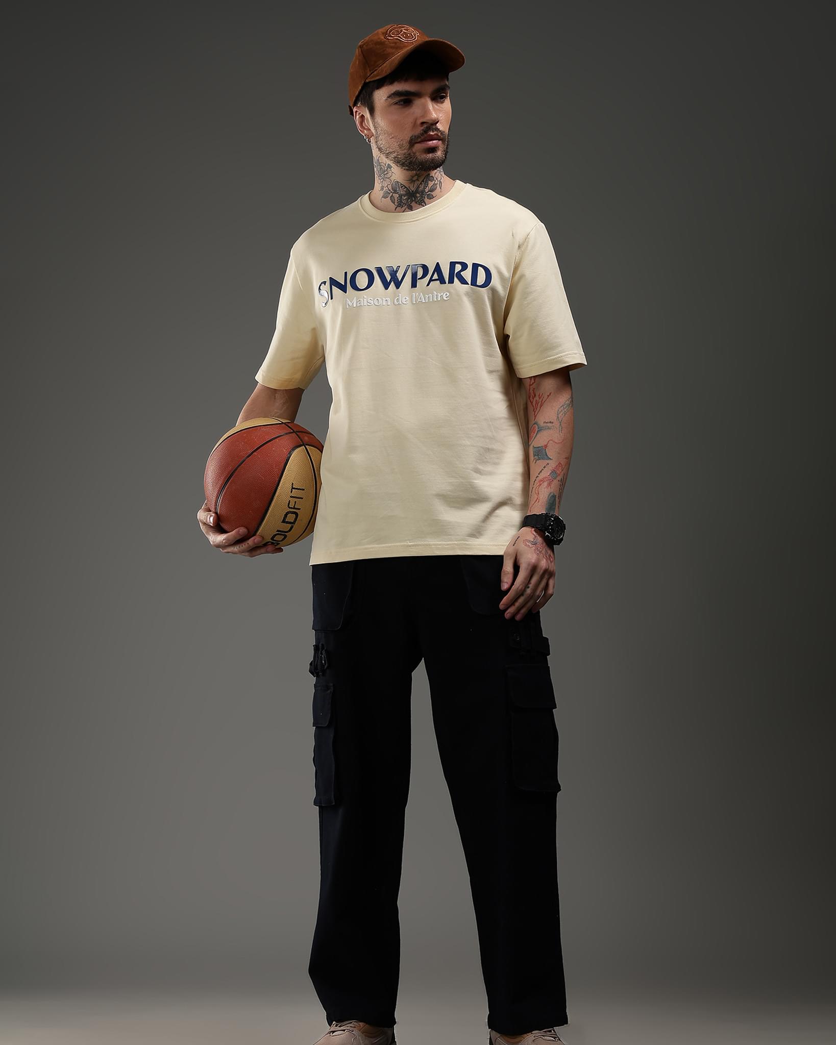 Snowpard Maison de l'Antre Relaxed Tee Beige — chest detail, Maison de l'Antre print close-up