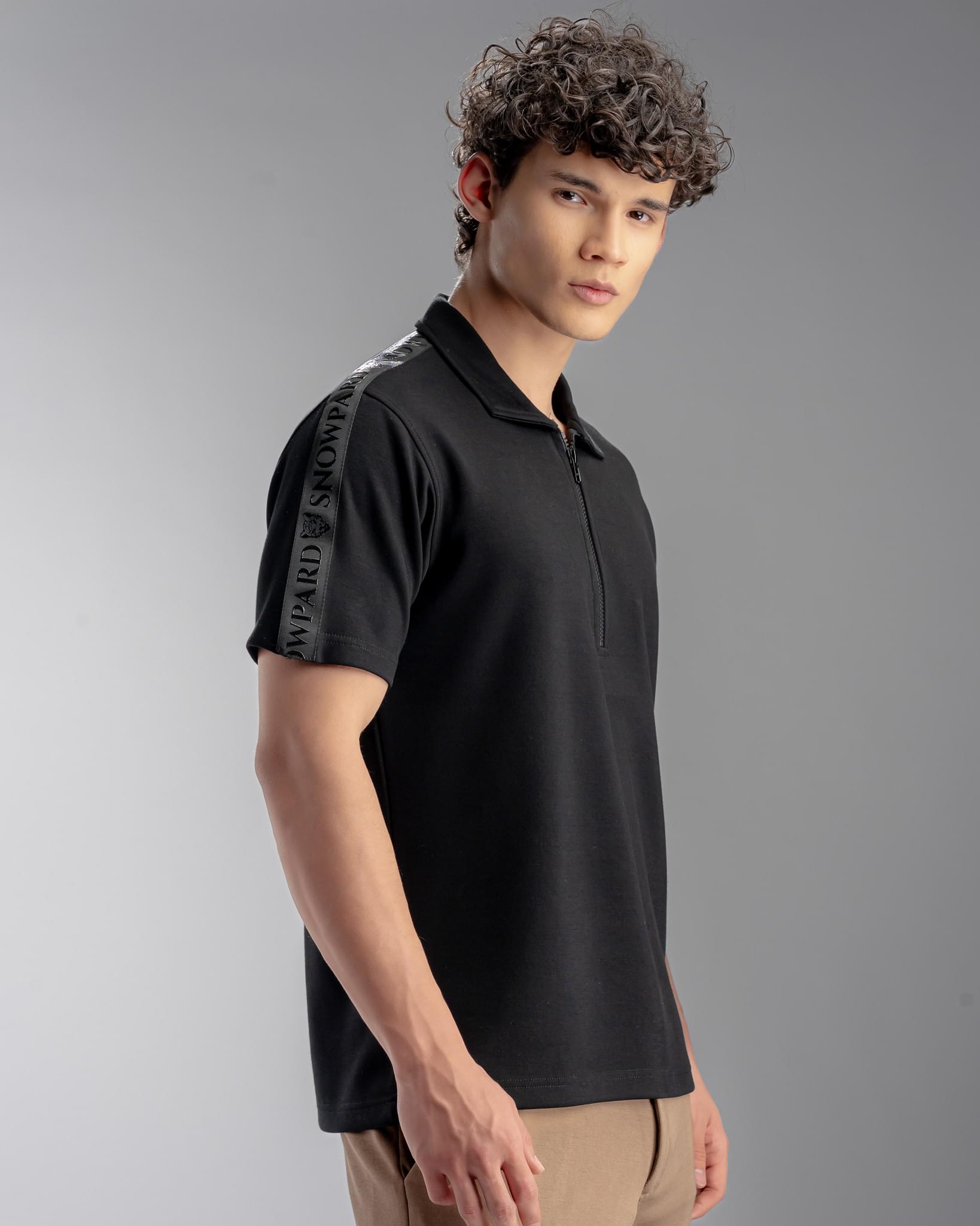Snowpard Milan Zip Polo Black — three quarter view, structured zip polo shirt