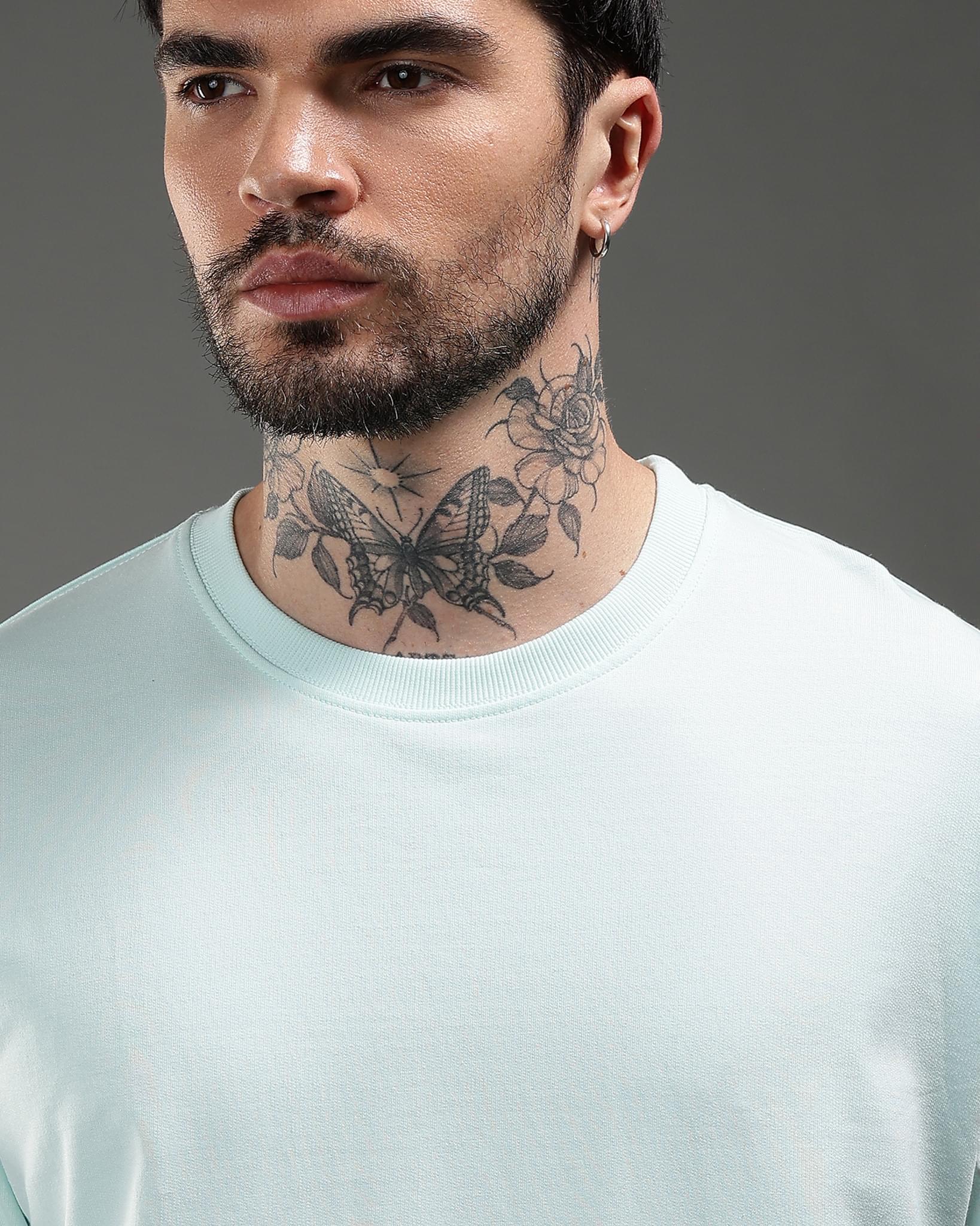 Snowpard Untamed Script Relaxed Tee Aqua Mist — chest detail, minimal front graphic