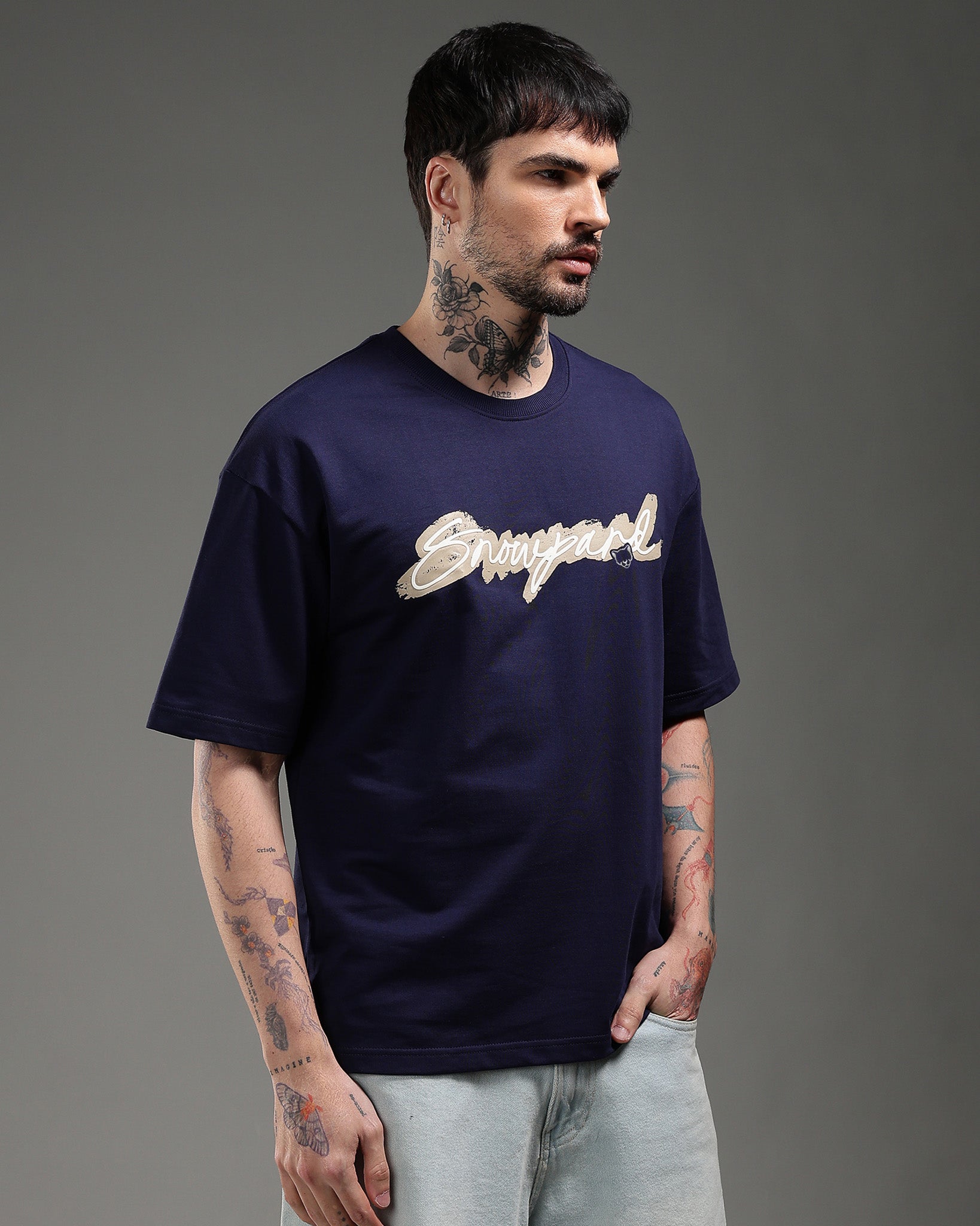 Snowpard The Art Relaxed Tee Navy — back view, script brushstroke base graphic