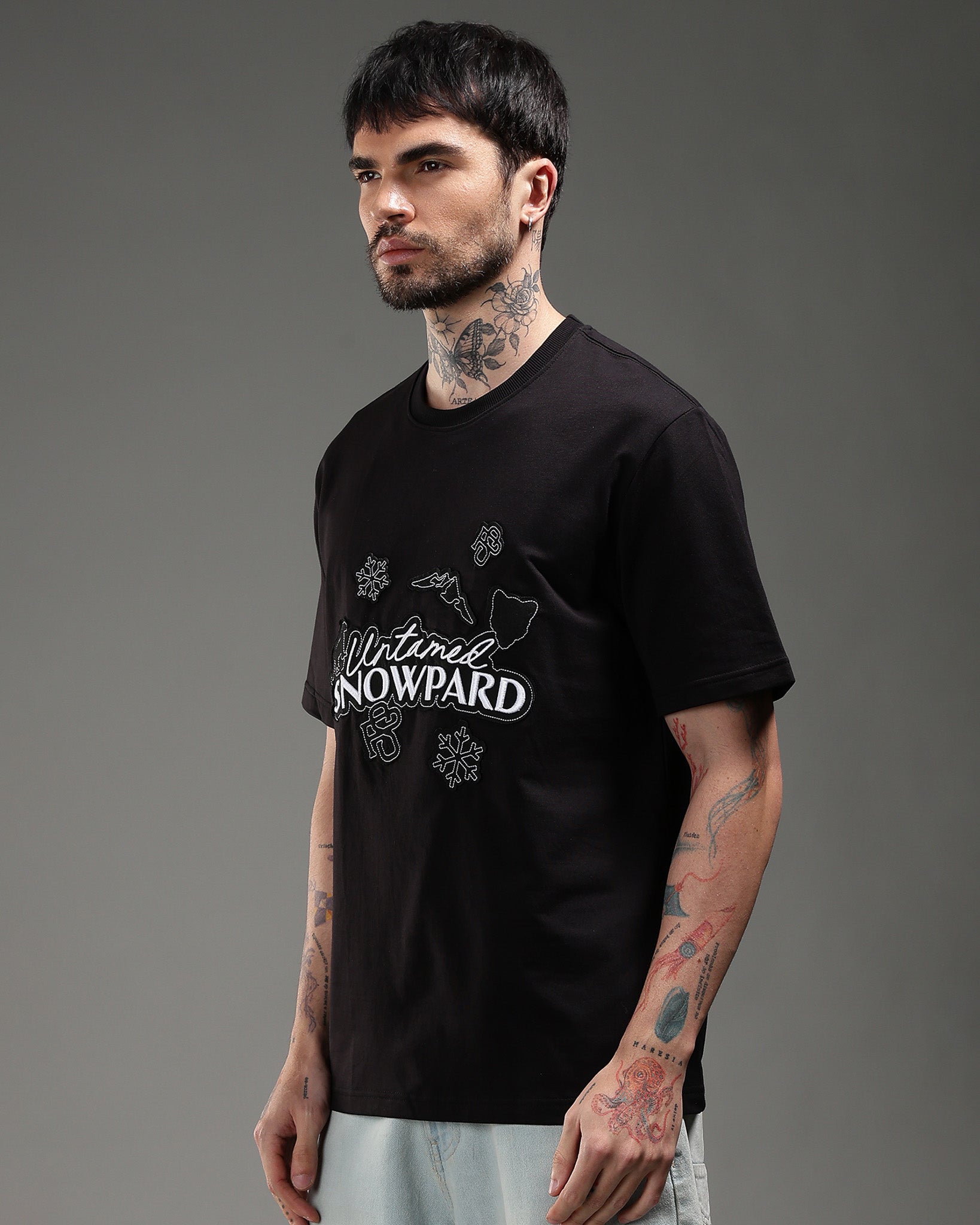 Snowpard Black Icon Embroidered Tee Black — back view, untamed leopard embroidered chest