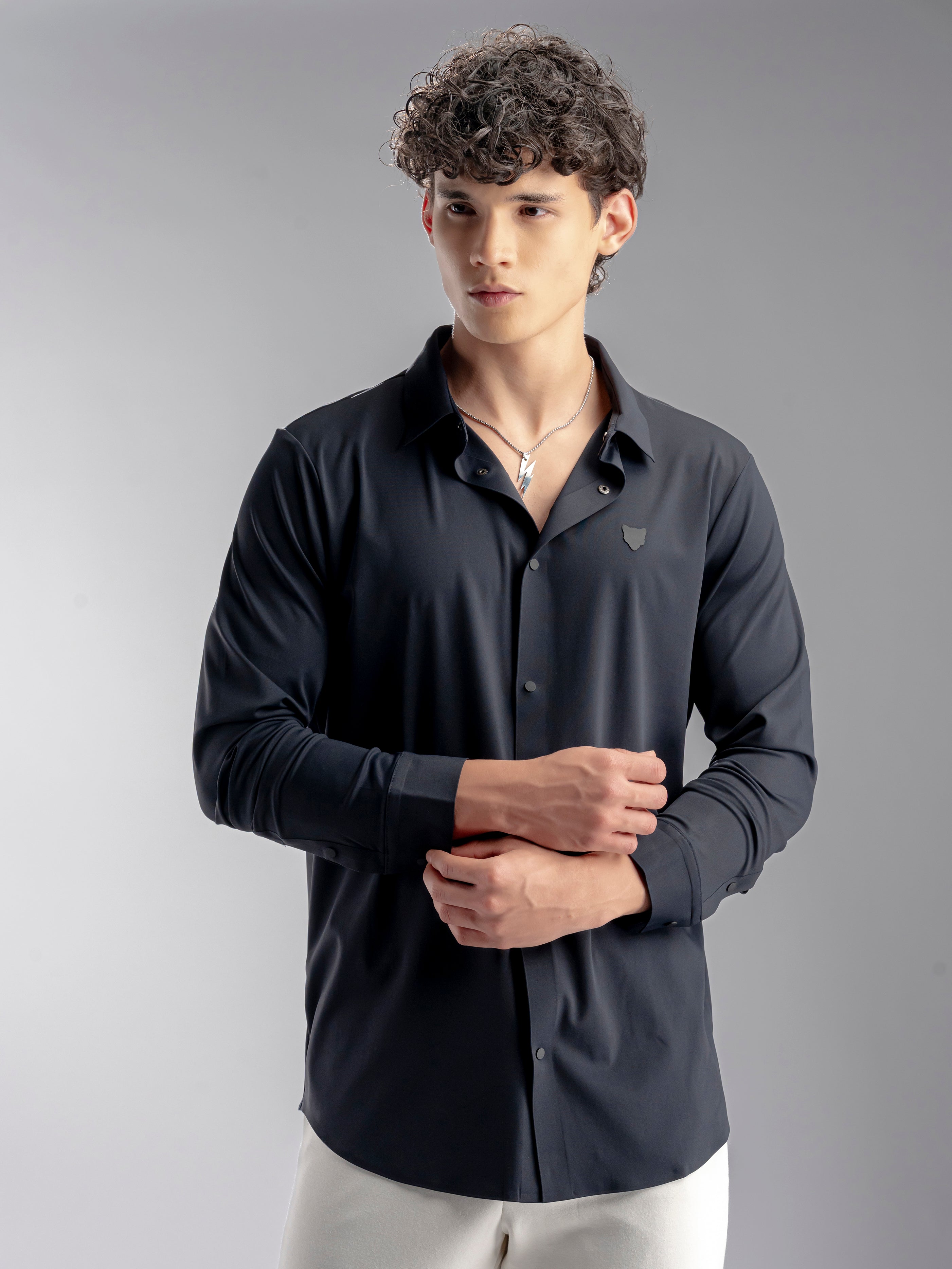 Man wearing a dark long-sleeve shirt 