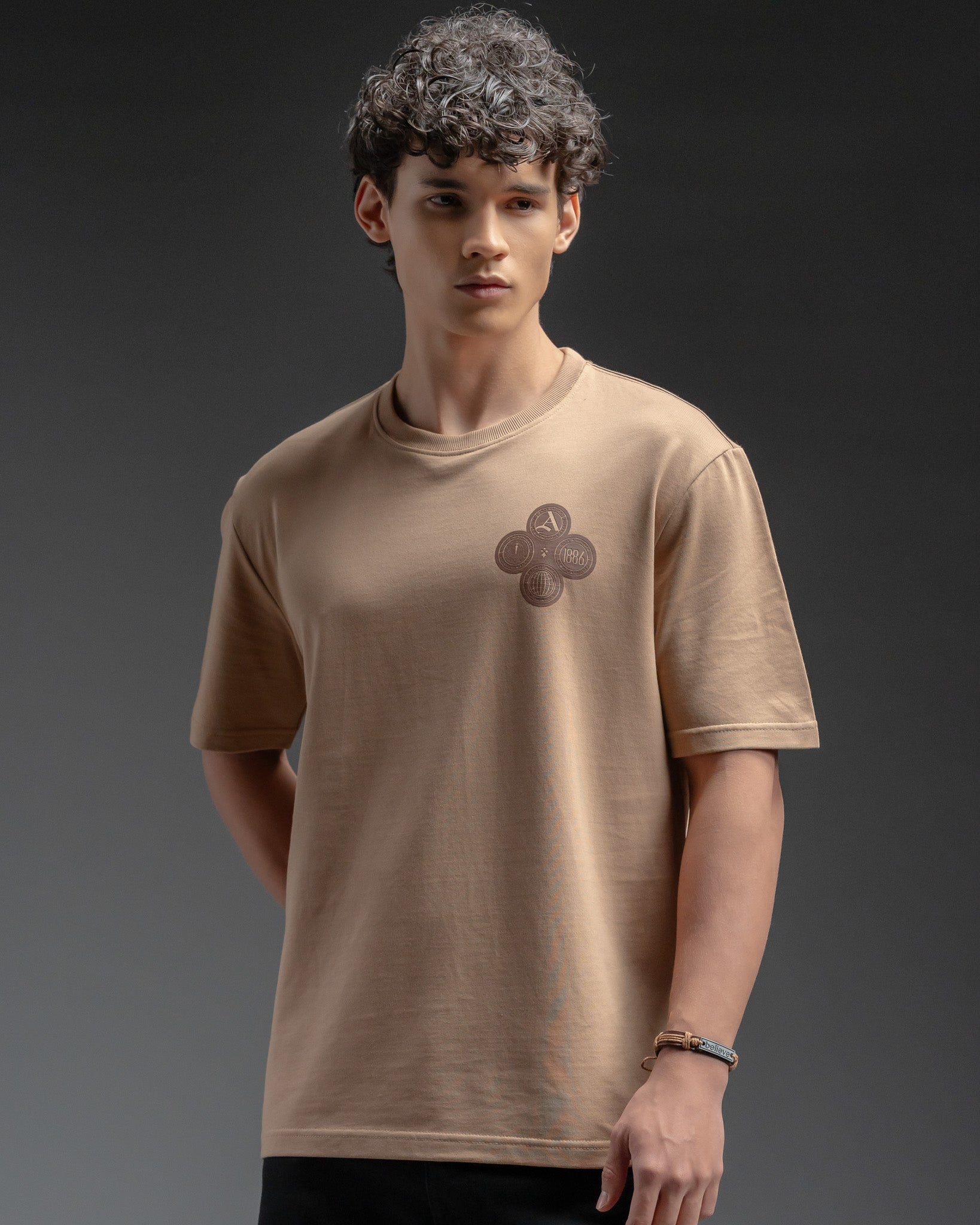 Snowpard Club Crest Relaxed Tee Desert Tan — back view, detailed club crest print
