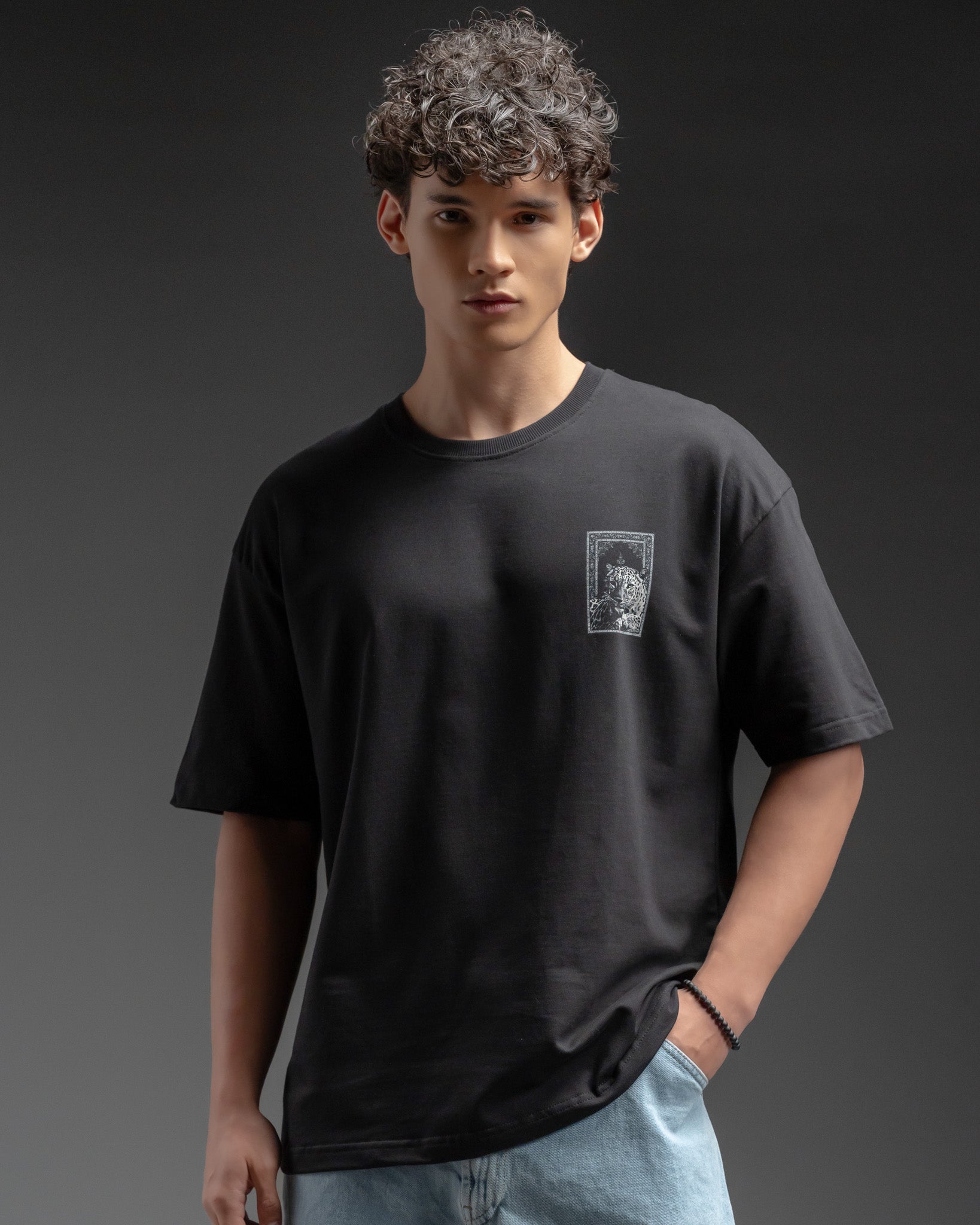Snowpard Black Carpet Oversized Tee — back view, Persian carpet leopard artwork