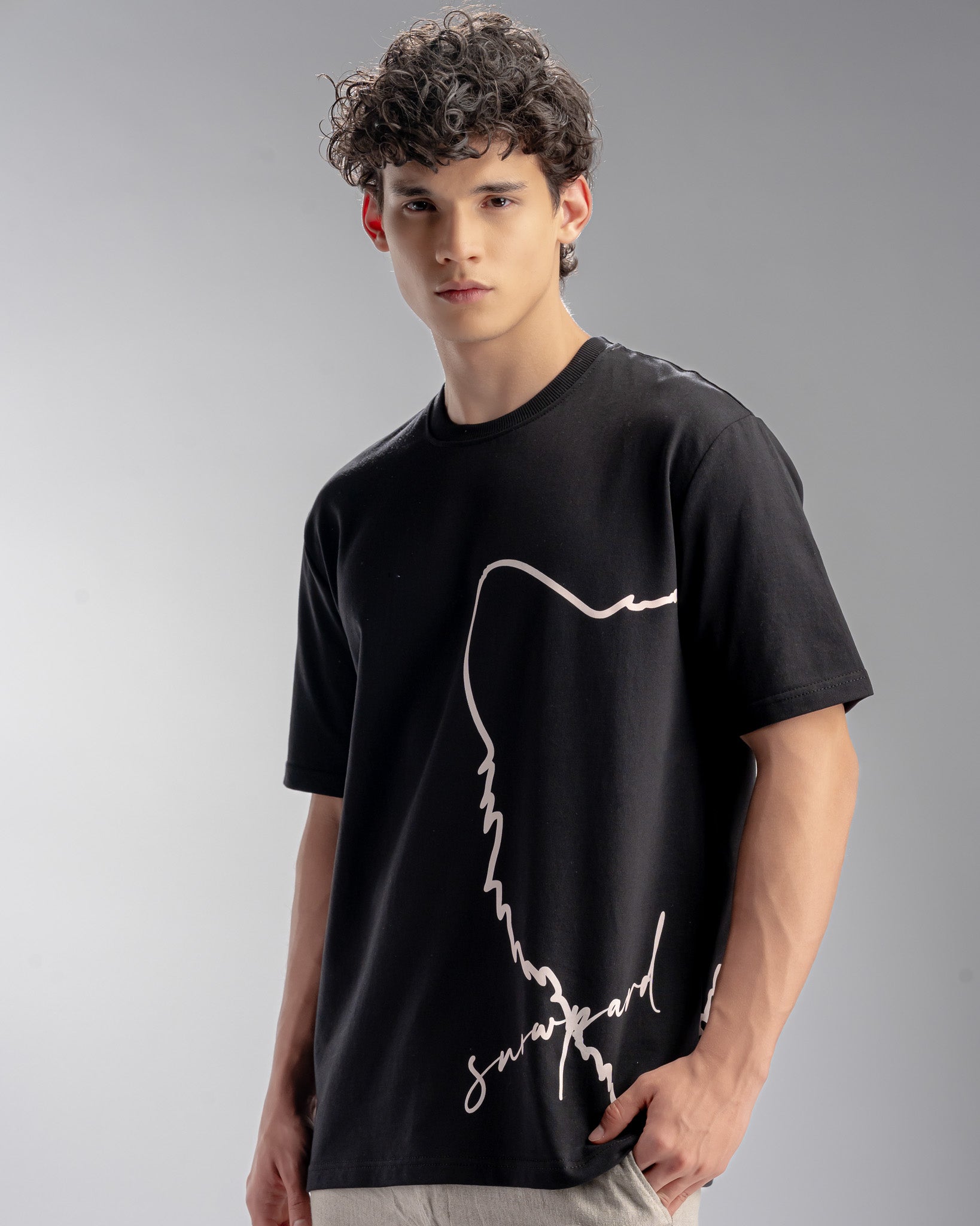 Snowpard Signature Script Tee Black — back view, elongated signature script print