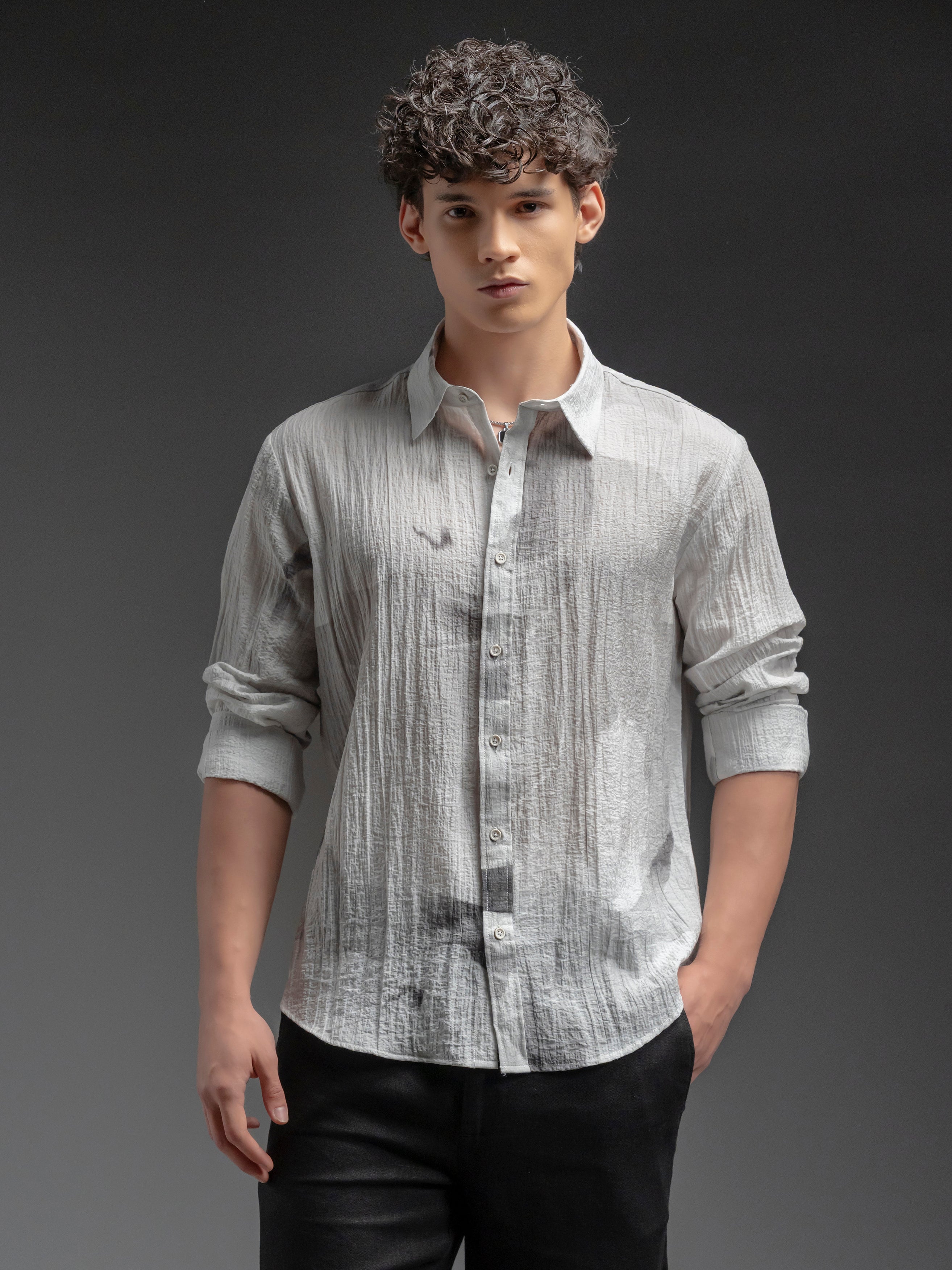 Person wearing a light gray textured shirt 