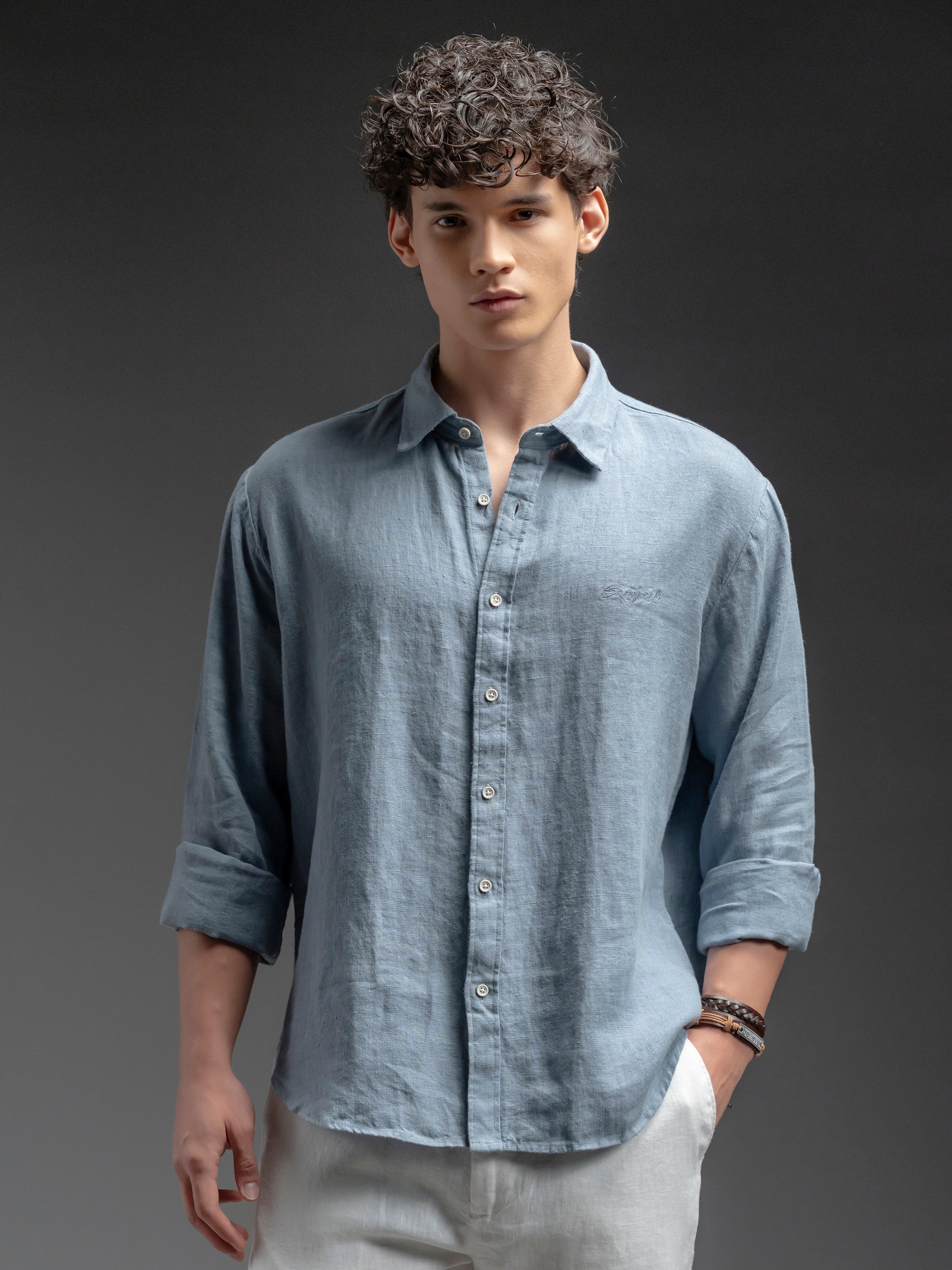 Man wearing a light blue button-up shirt 