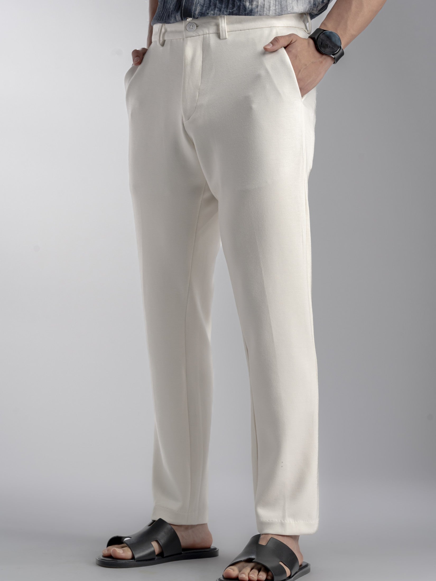 Person wearing white dress pants 