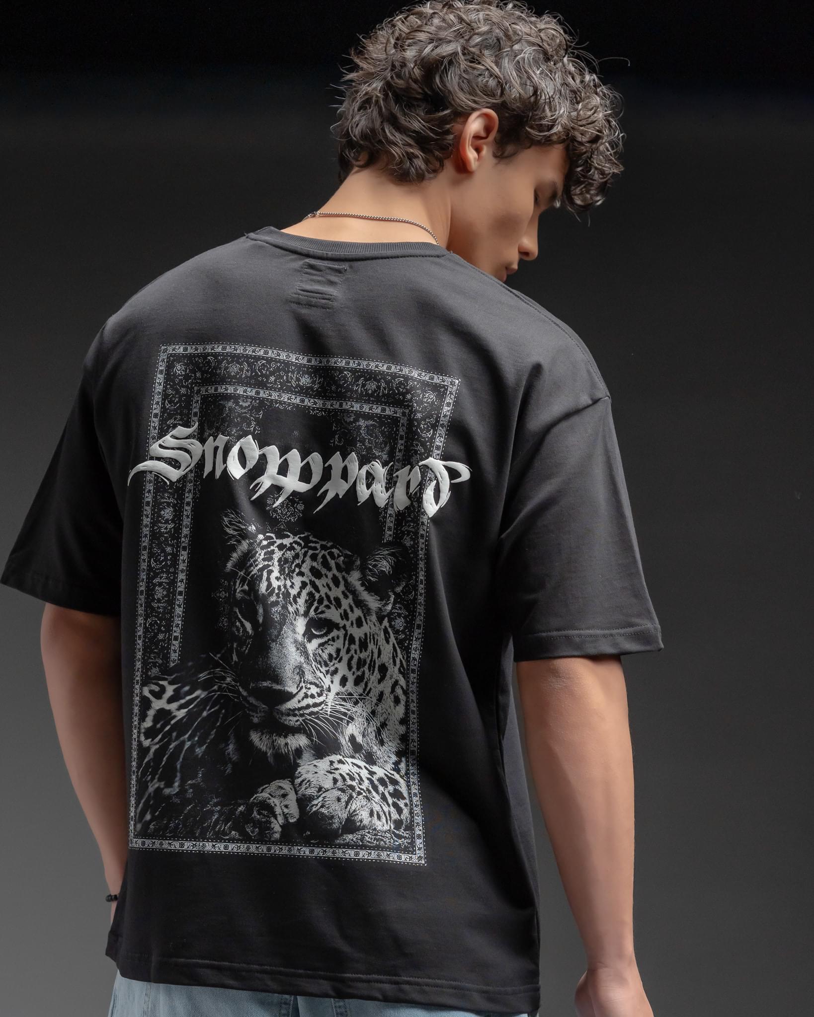 Snowpard Black Carpet Oversized Tee — chest detail, emblem close-up front