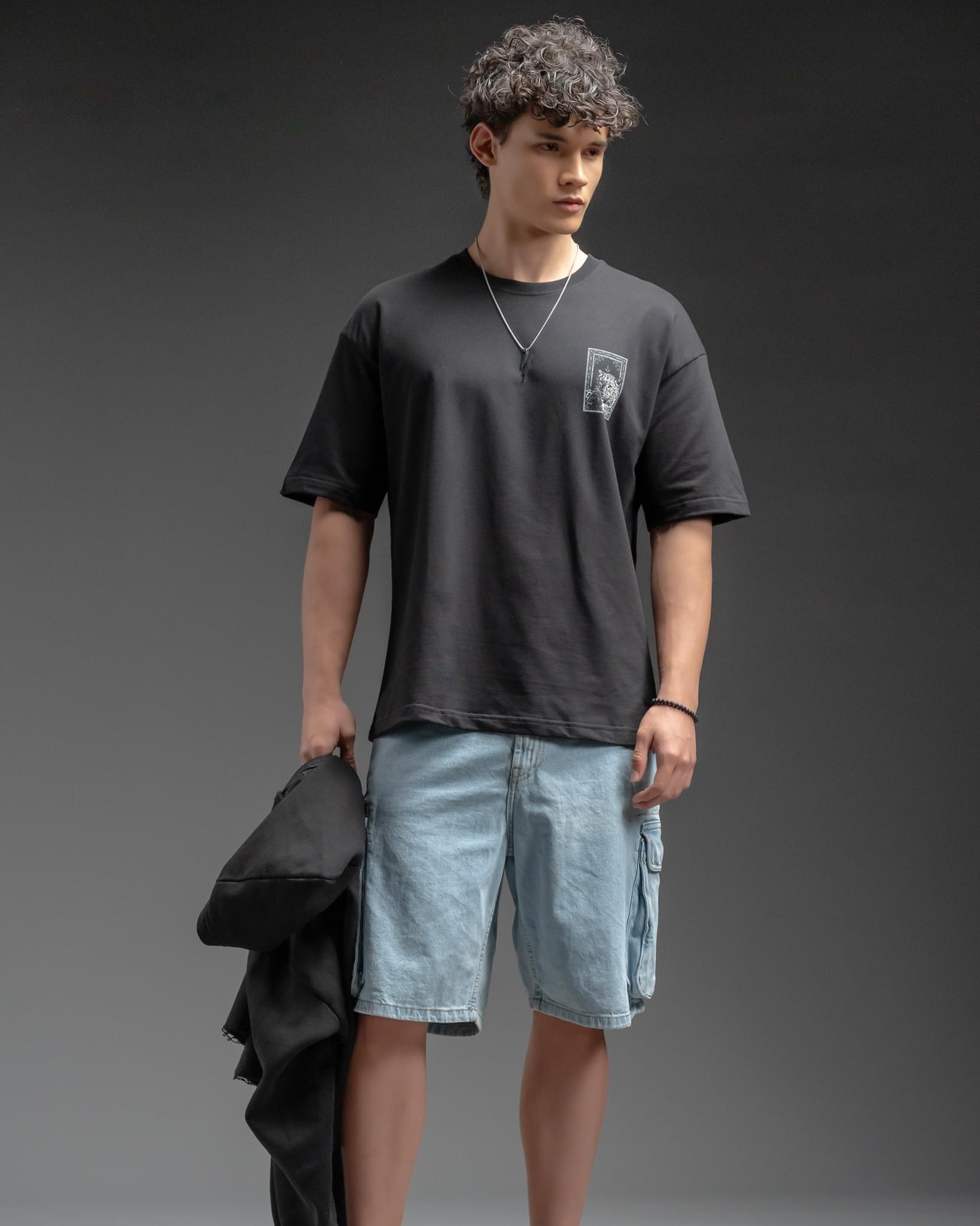 Snowpard Black Carpet Oversized Tee — model shot, men's statement graphic t-shirt