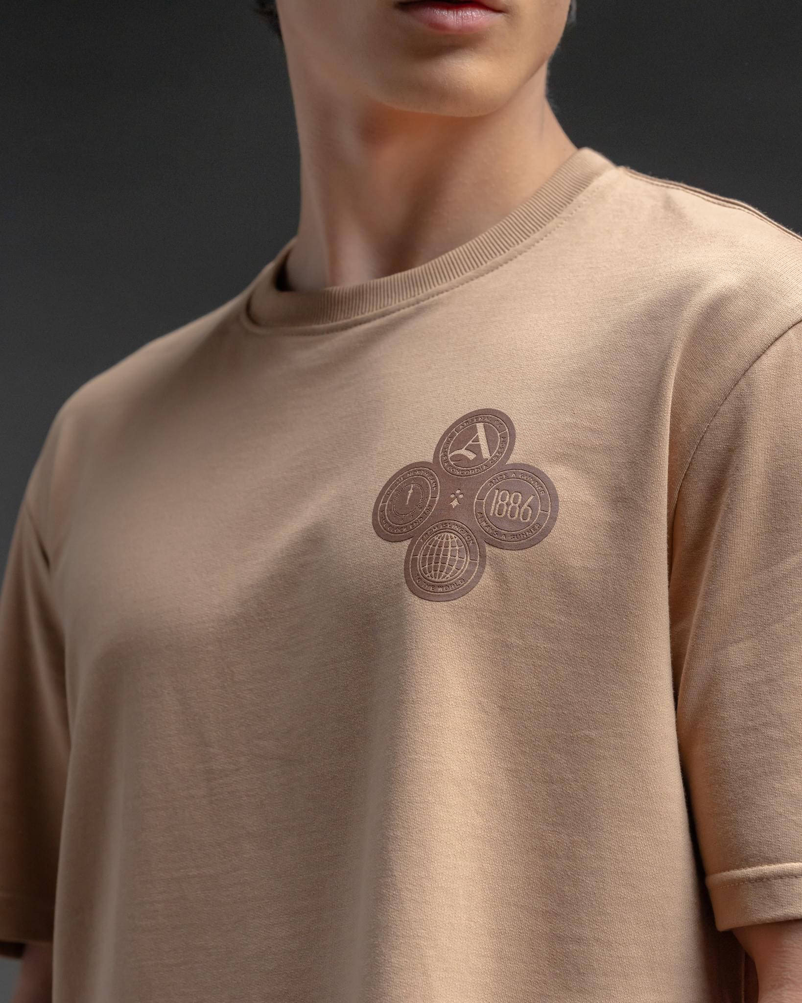 Snowpard Club Crest Relaxed Tee Desert Tan — side view, Supima cotton relaxed tee