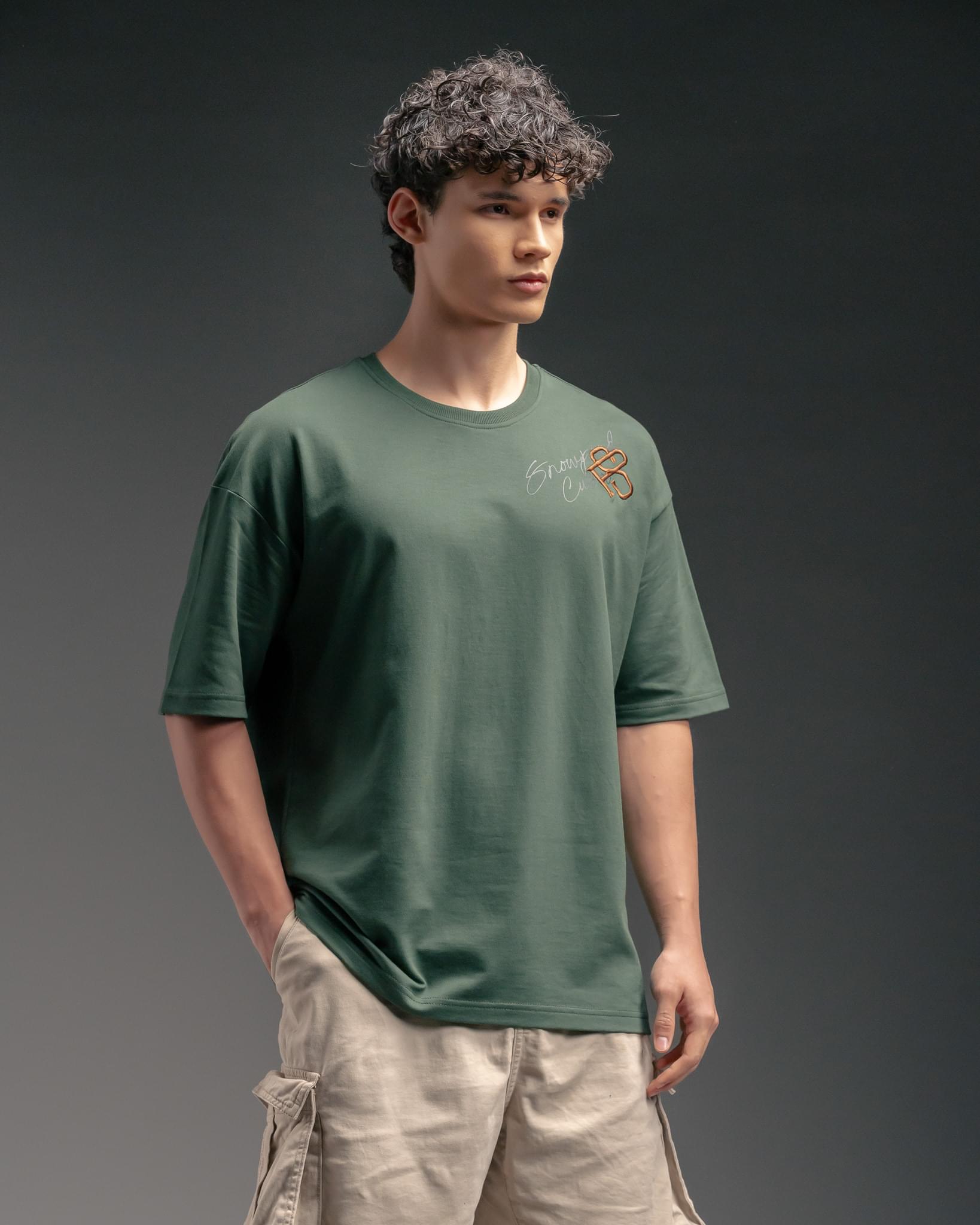 Snowpard Custos Relaxed Tee Forest Green — back view, refined Custos chest graphic embroidery