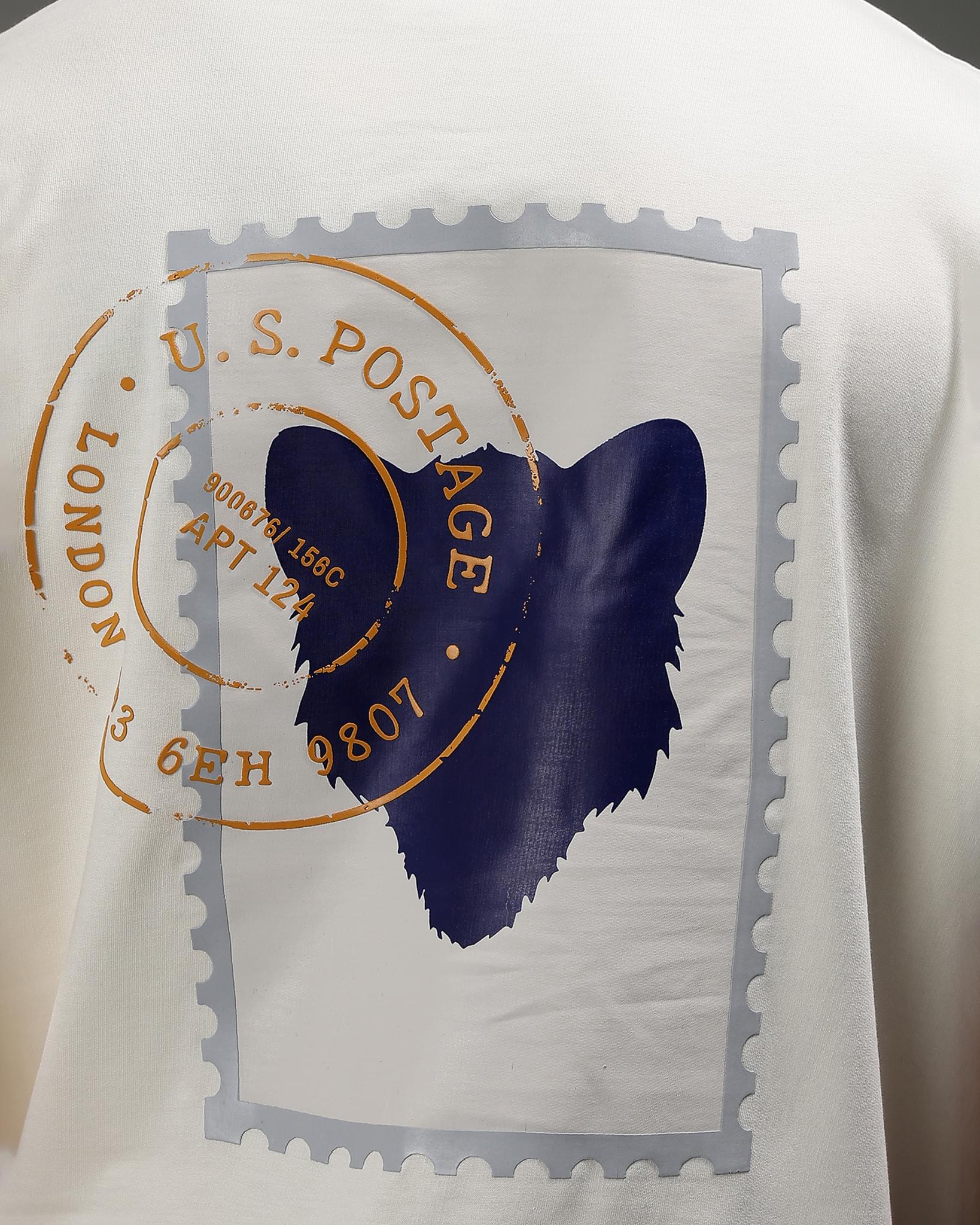 Snowpard Global Stamps Relaxed Tee Off White — chest detail, vintage postage stamp collage