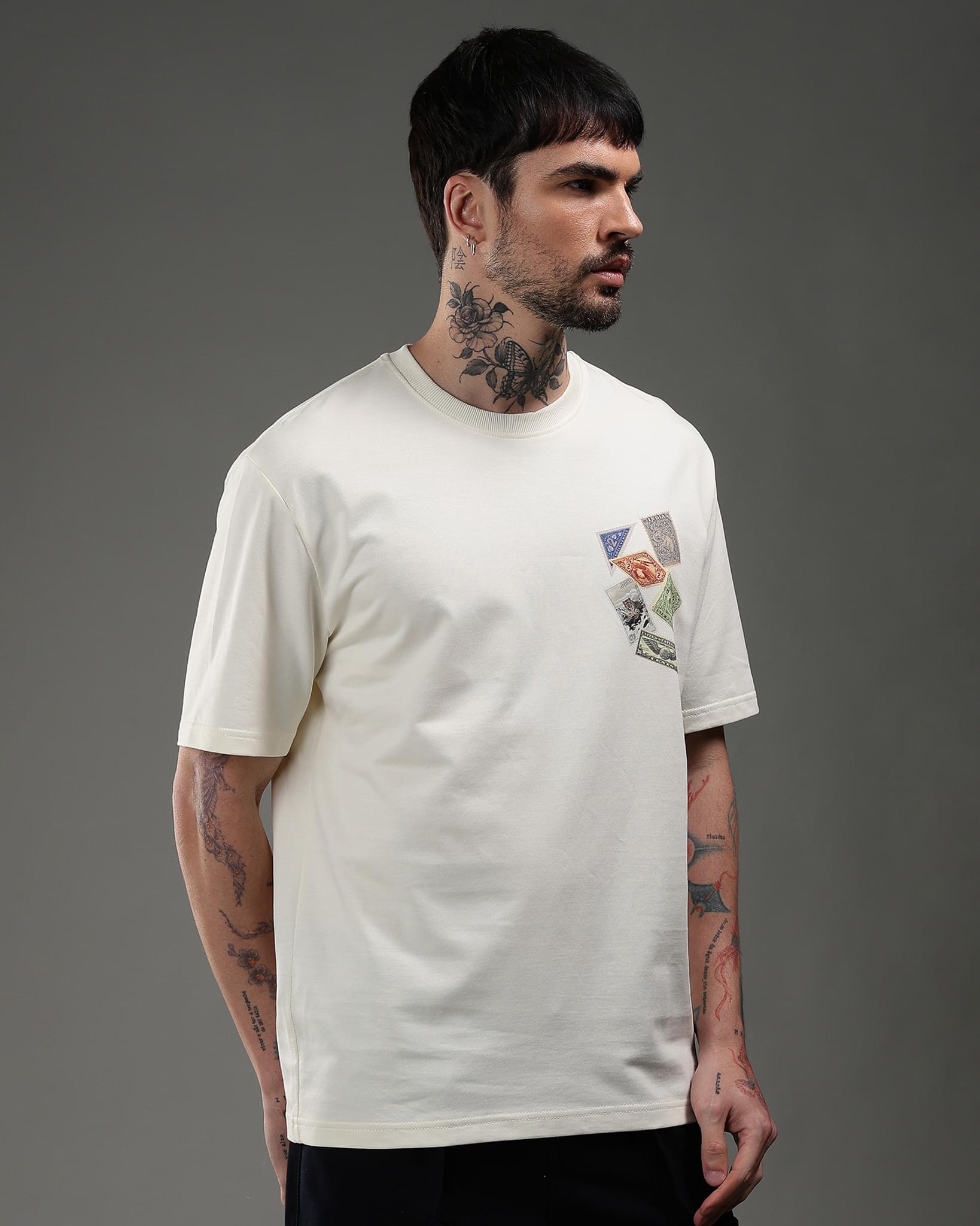 Snowpard Global Stamps Relaxed Tee Off White — back artwork detail, postal seal stamp print