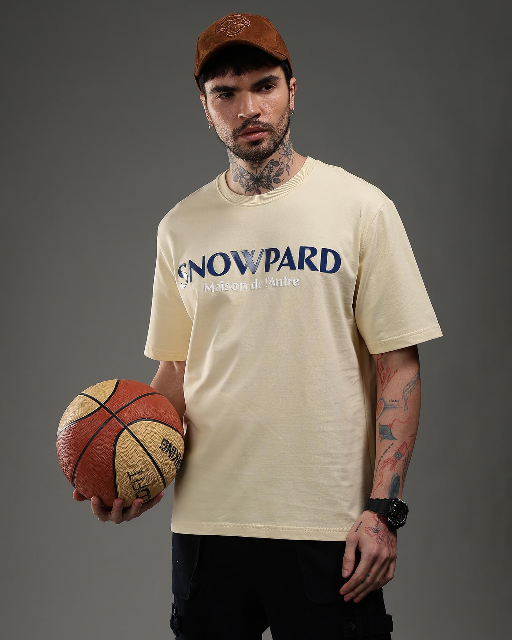 Snowpard Maison de l'Antre Relaxed Tee Beige — model shot, premium men's graphic t-shirt
