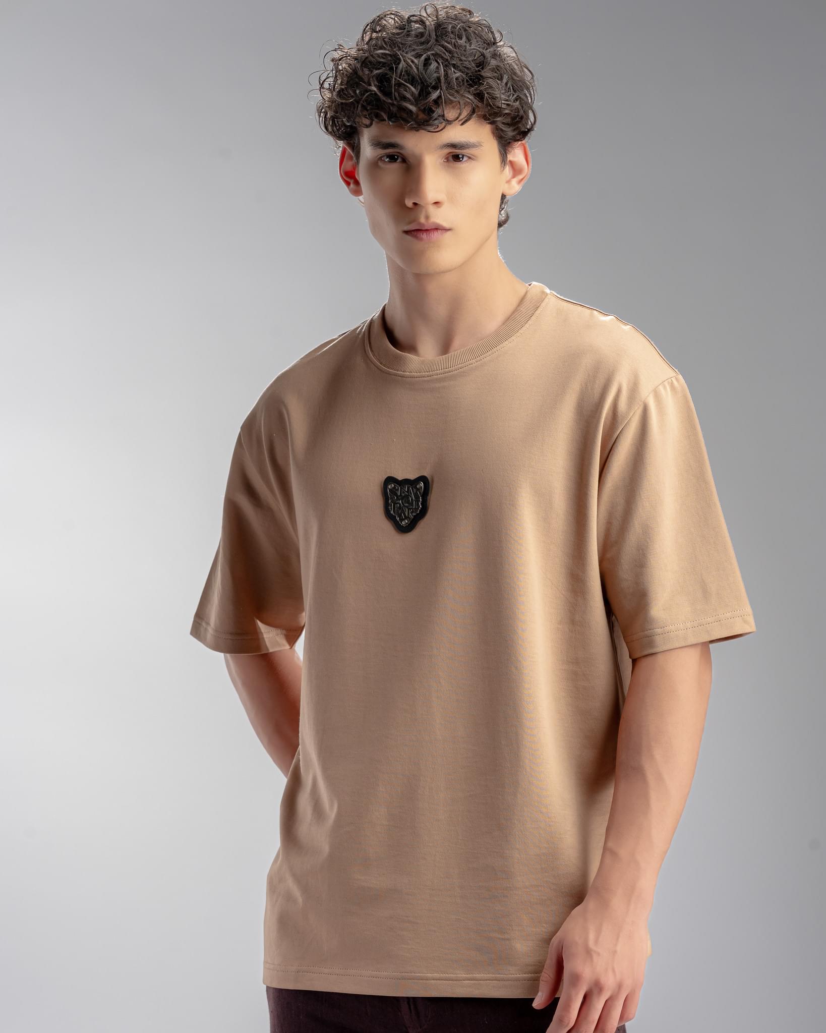 Snowpard Metal Badge Relaxed Tee Sand — side view, premium Supima cotton relaxed tee