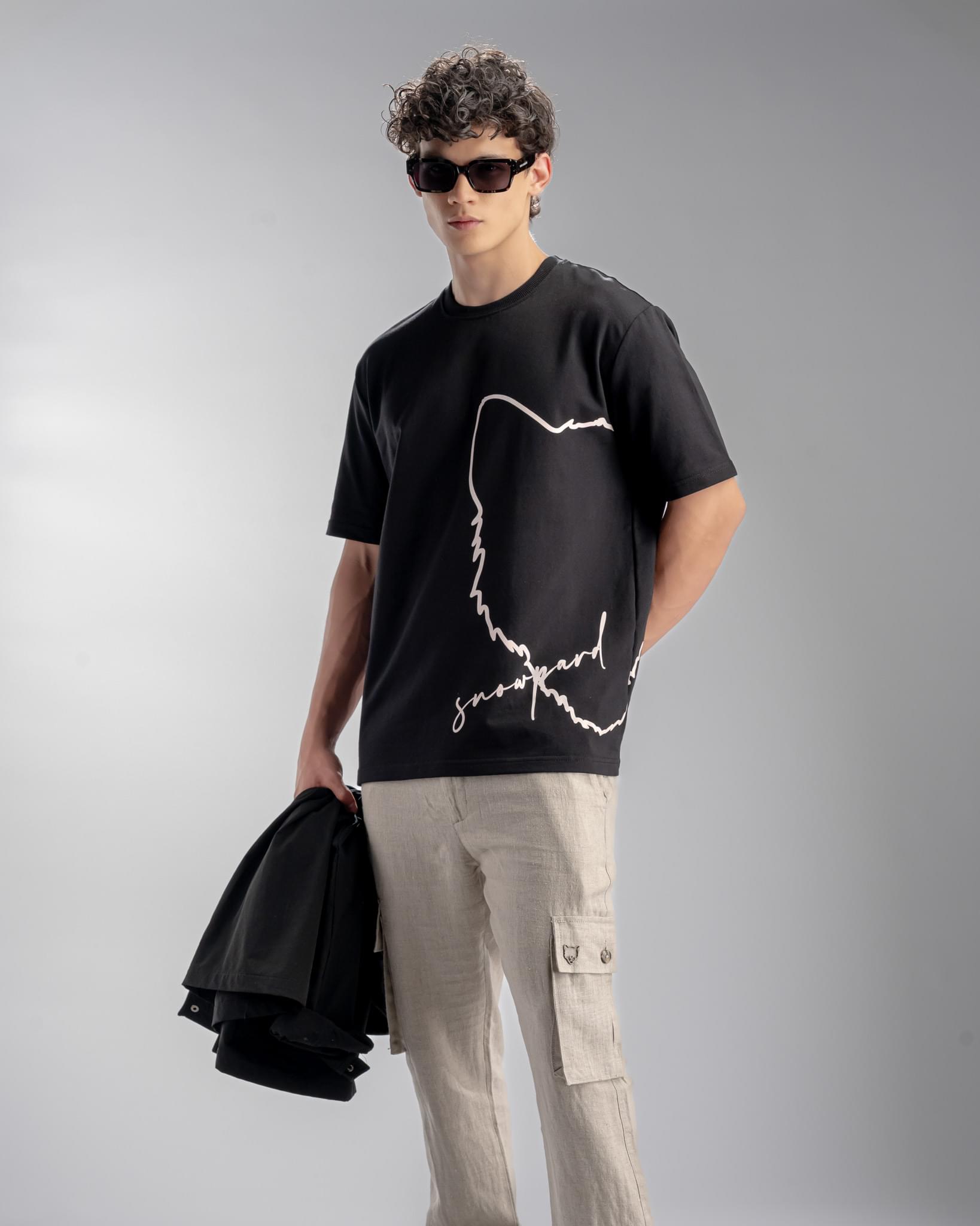 Snowpard Signature Script Tee Black — model shot, men's designer graphic t-shirt
